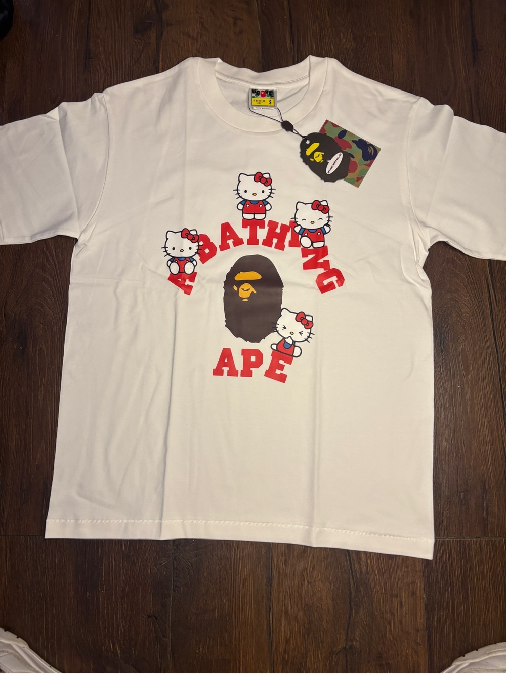 Bape White Tee with Red Logo and Multicolor Hello Kitty Graphics